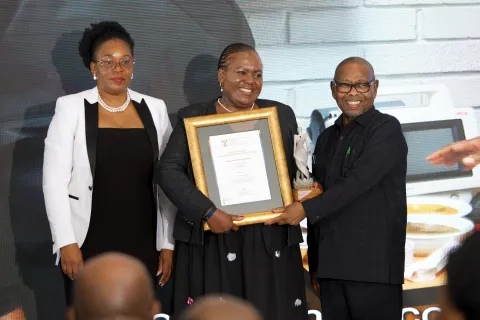 Prof. Tebogo Mothiba receives the Distinguished Woman Researcher award in the Innovation for Impact category from Prof. Blade Nzimande, MP, Minister of Science, Technology and Innovation. [Photo credit to be confirmed — DSTI]